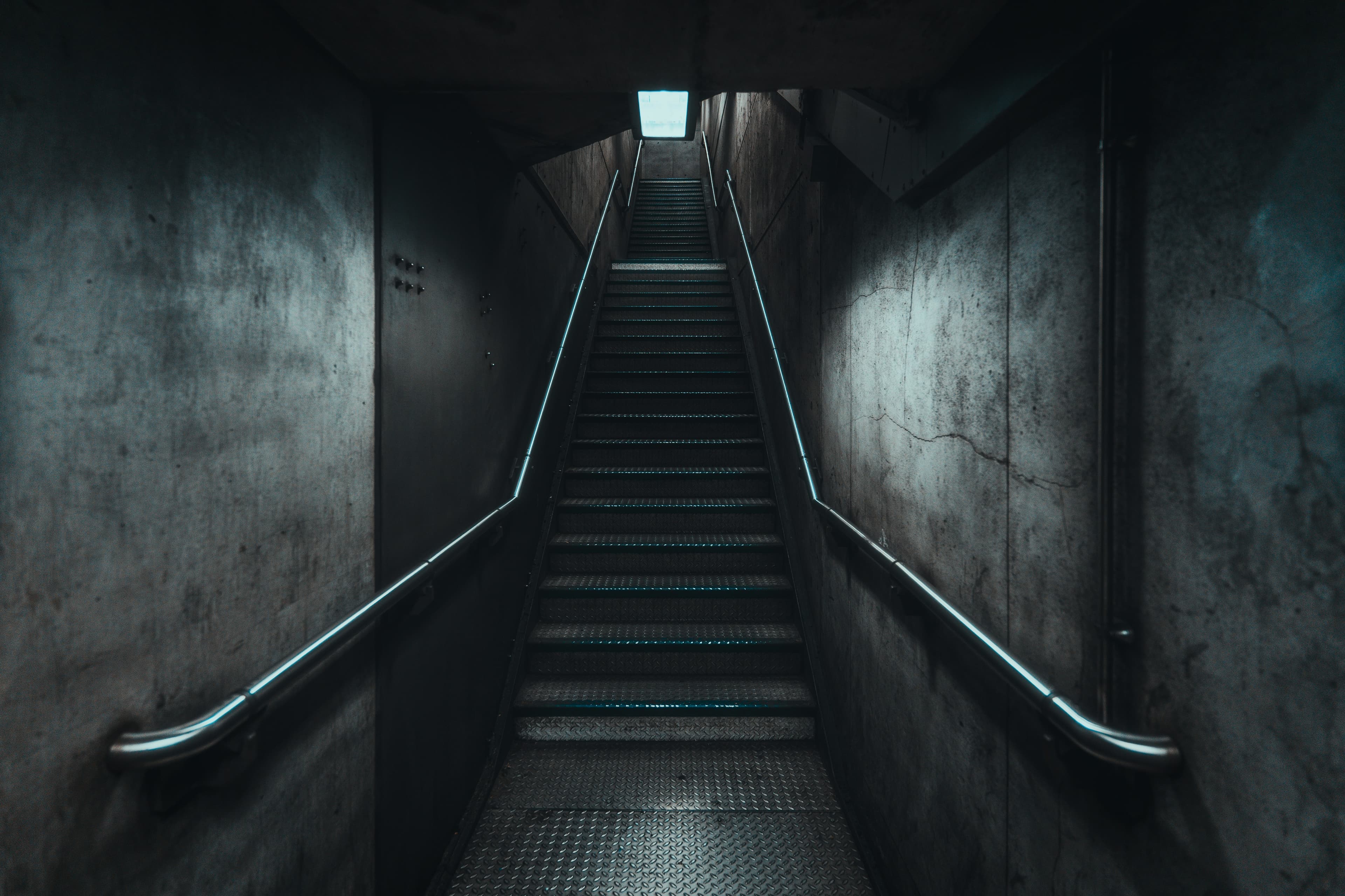 A dark concrete stairwell
