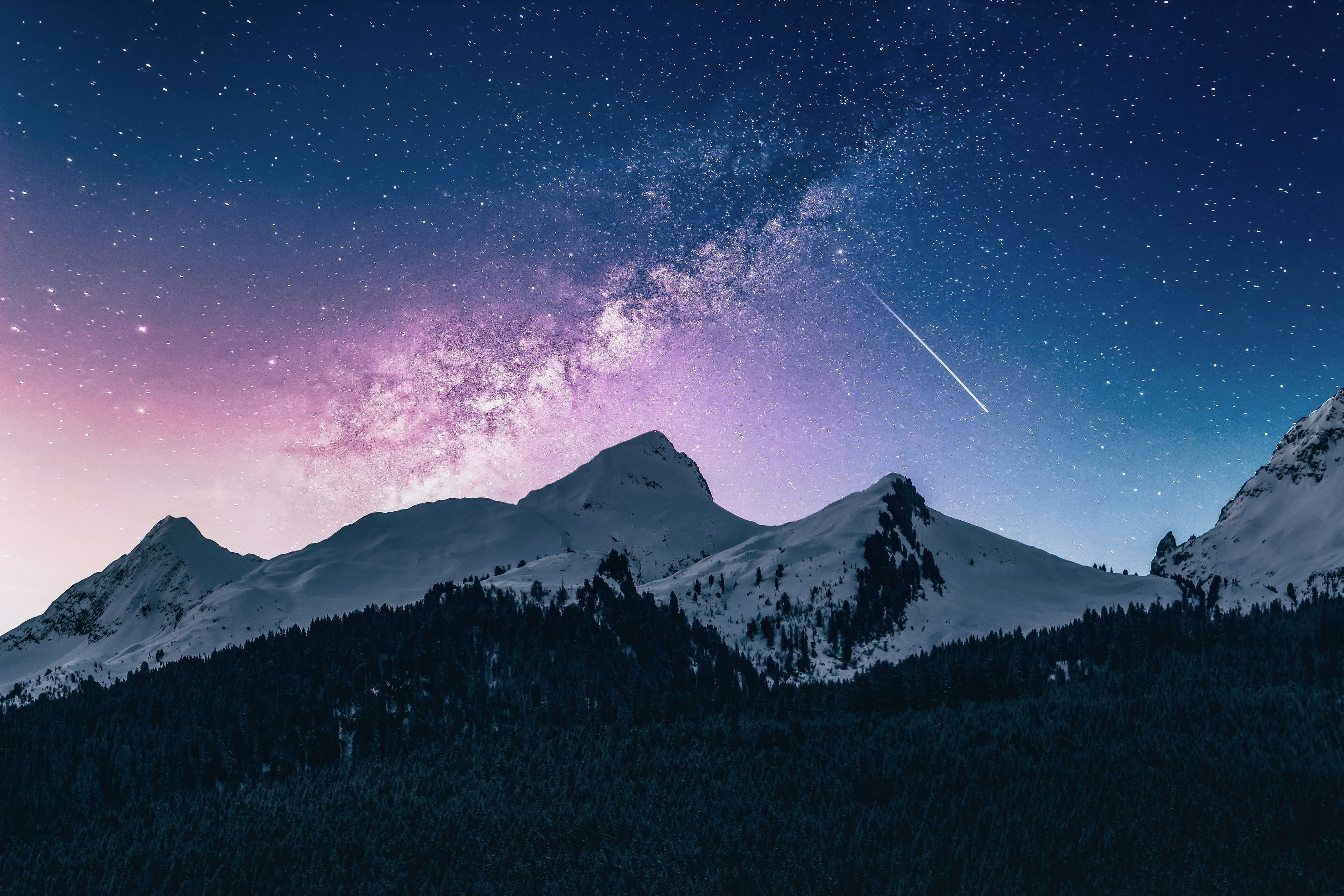 The Milky Way over snowcapped mountains